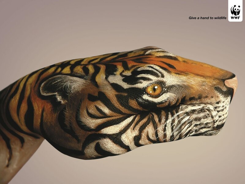 tiger face painted on hand