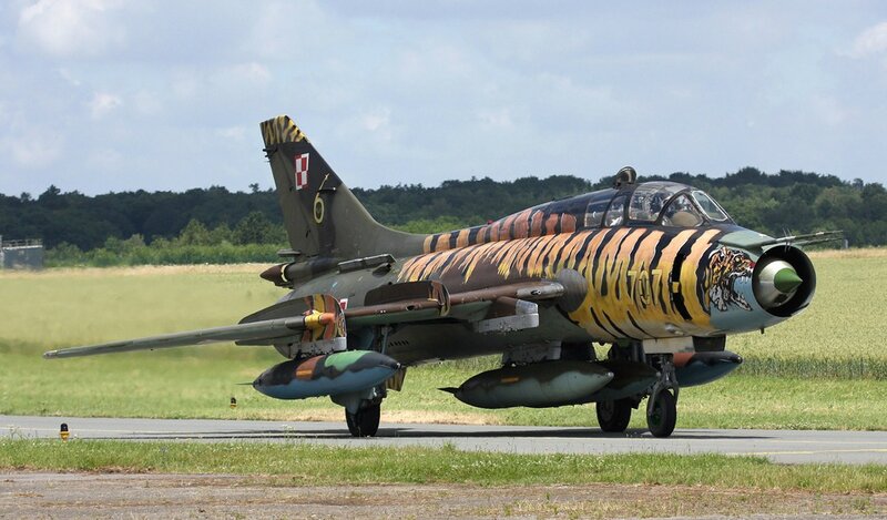 Tiger-striped Jet on Runway — Green