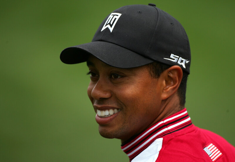 Tiger Woods smiling on golf course