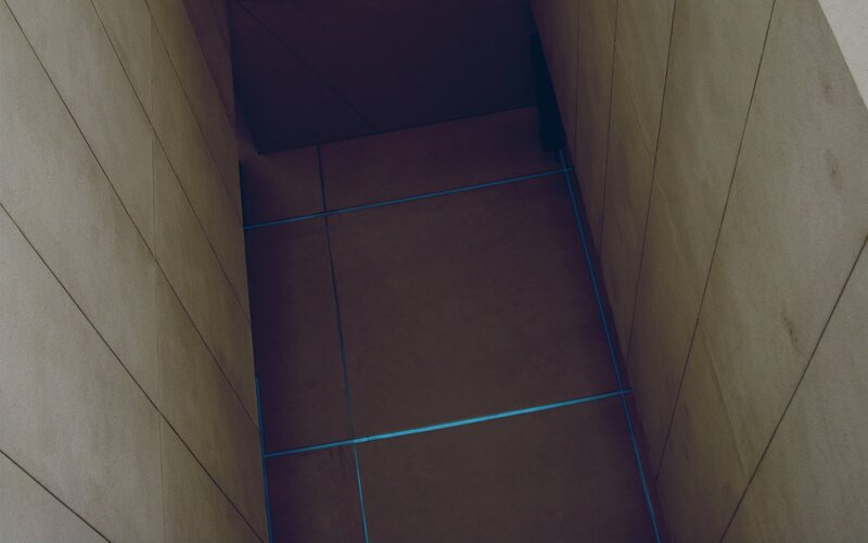 tiled corridor with blue lines