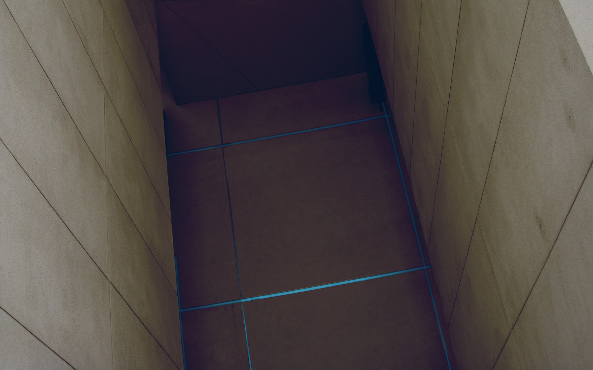 tiled corridor with blue lines