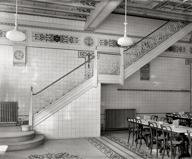 Tiled stairwell with ornate railings