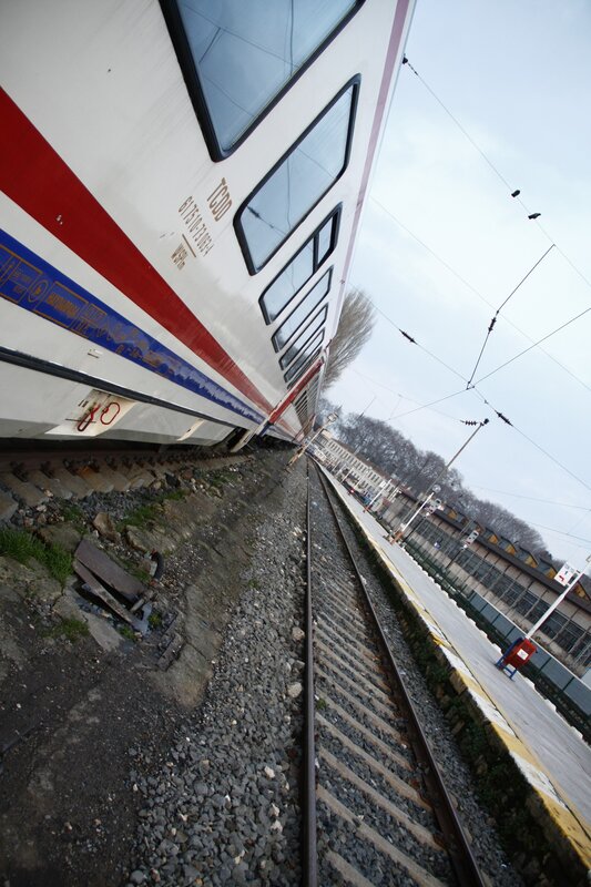 tilted train at a station