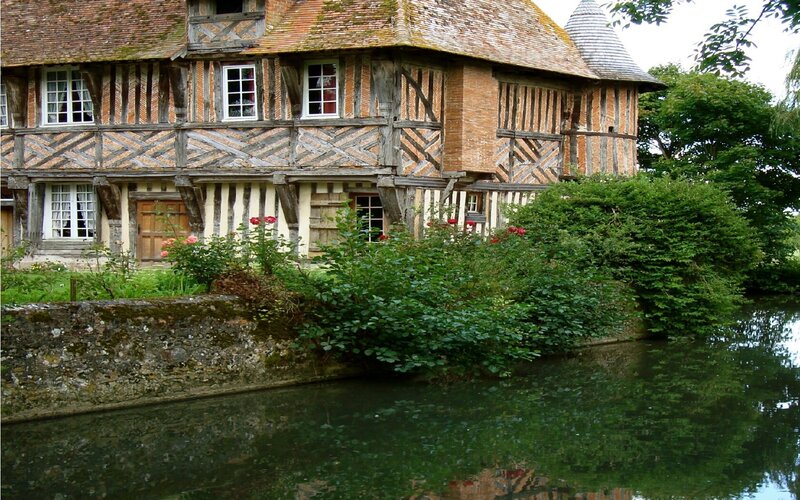 Timber-framed house by a river