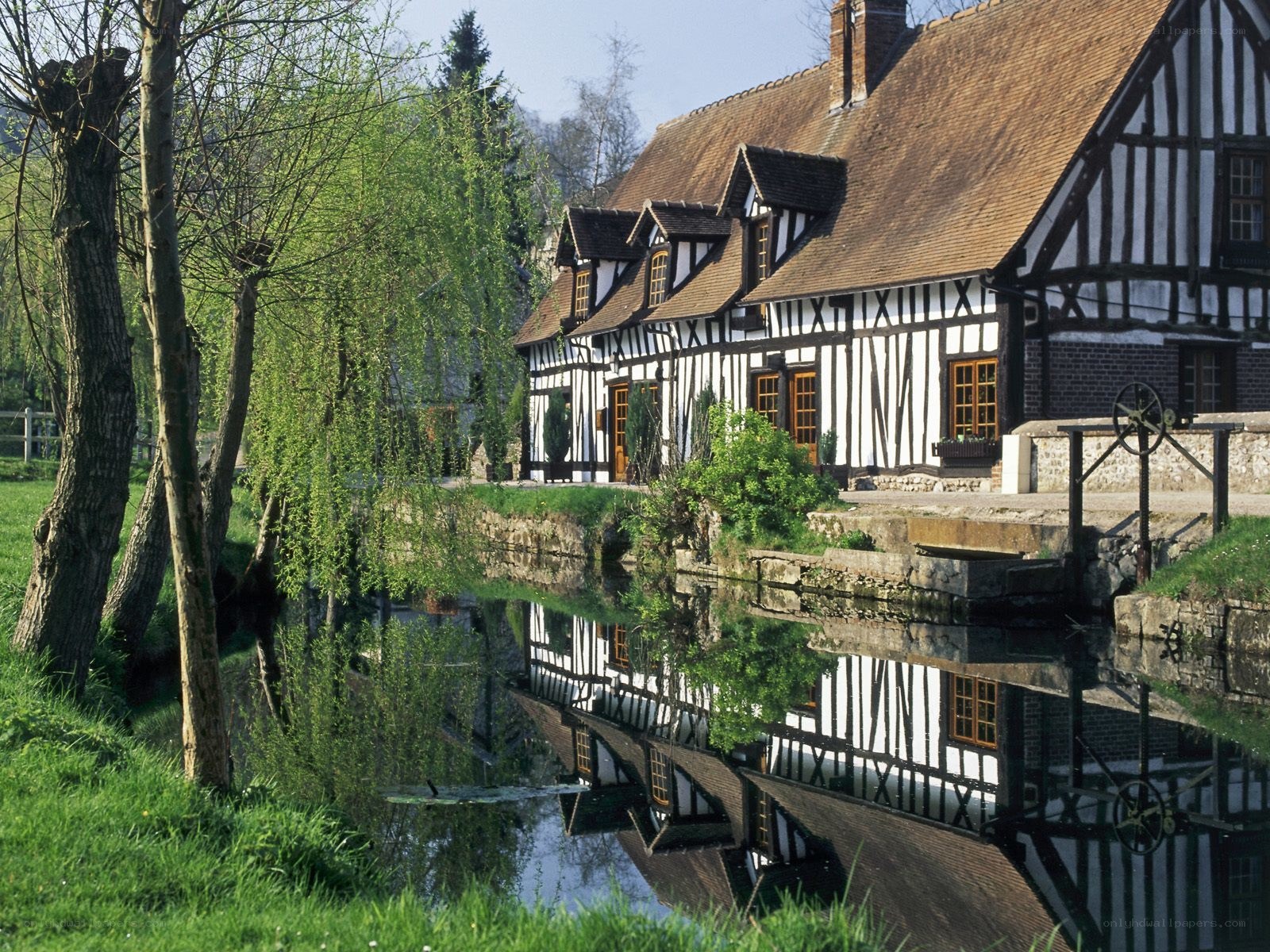 Timber-framed houses by a river