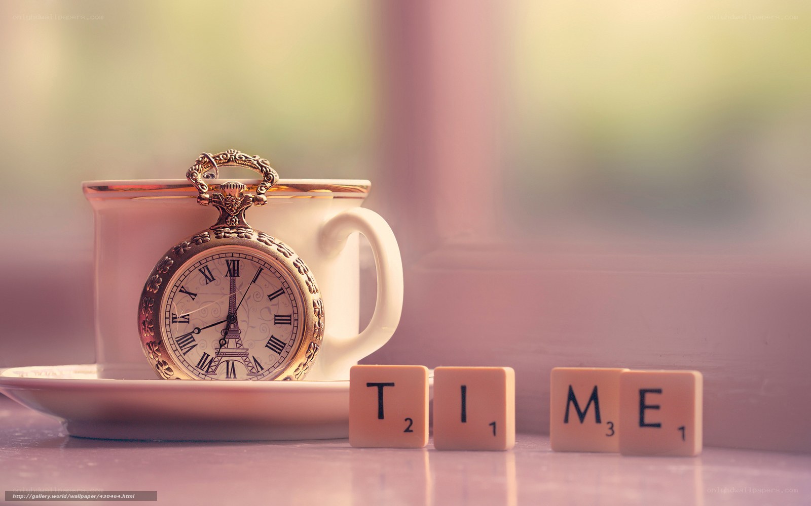 Time concept with pocket watch and scrabble tiles