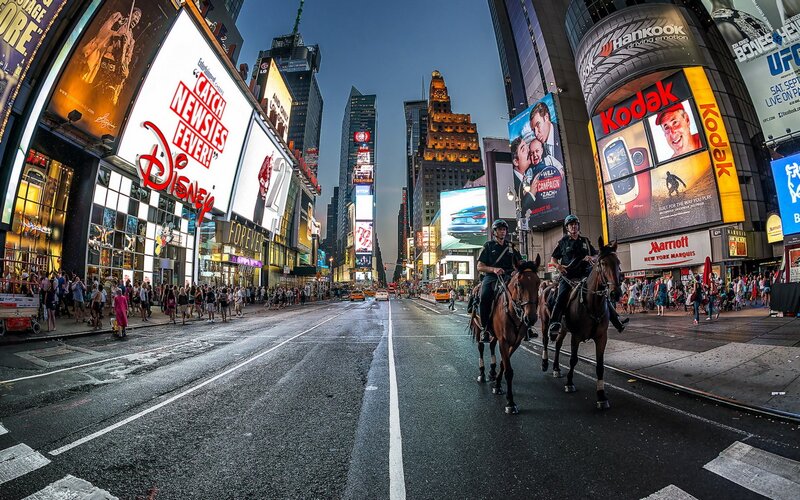Times Square at dusk with mounted police