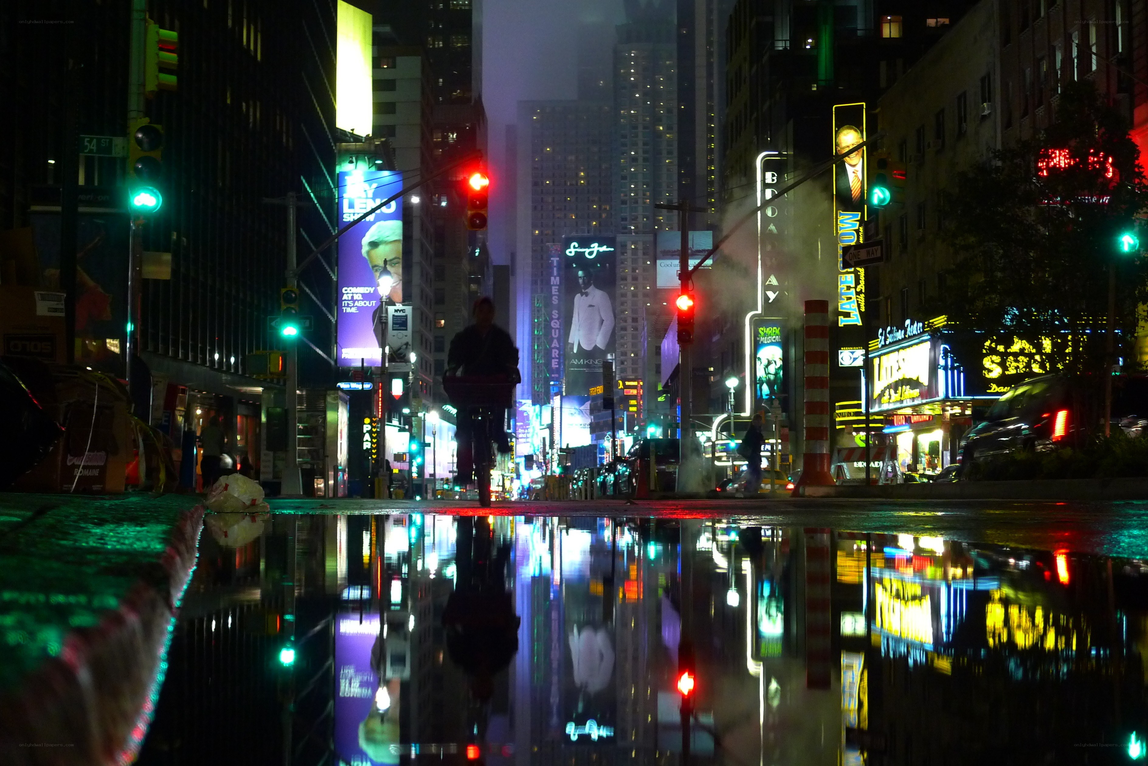 Times Square at night with reflections