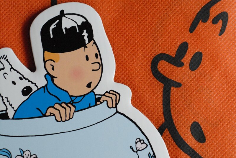 Tintin and Snowy in a boat