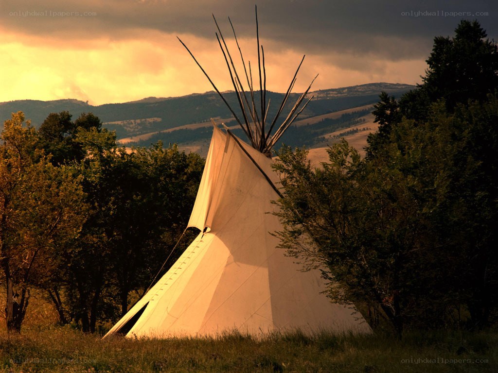 Tipi at sunset in the mountains