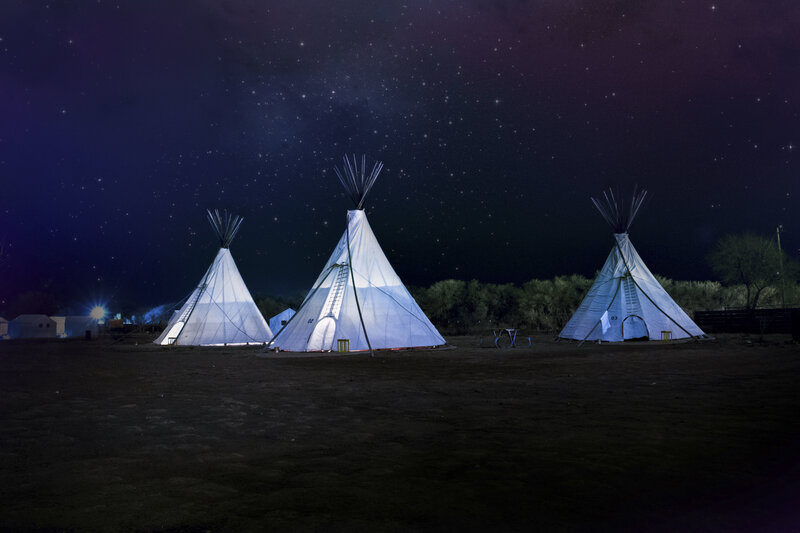 Tipis under starry night sky
