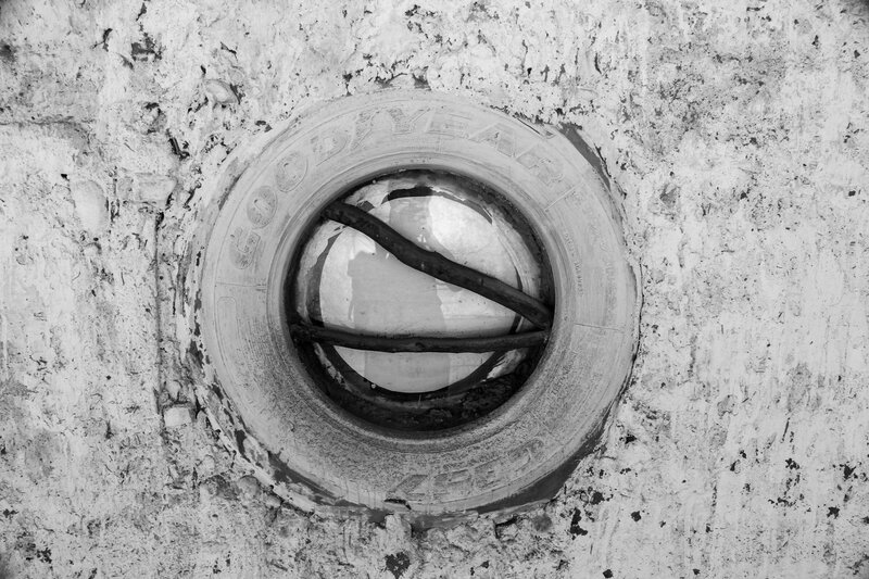 Tire in Concrete Wall