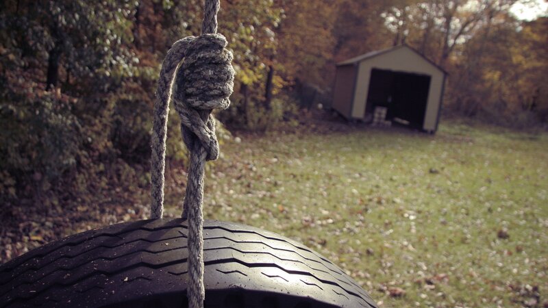 tire swing in autumn yard
