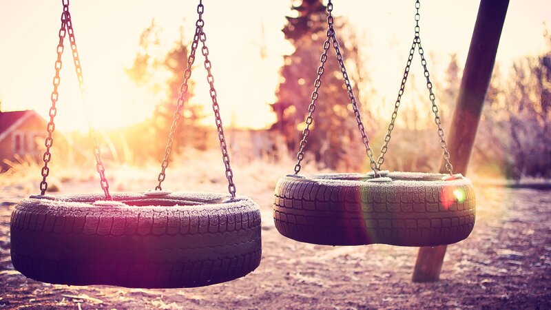 tire swings at sunset