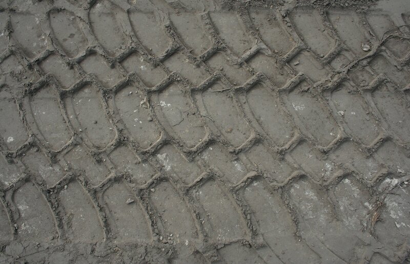 tire tracks in muddy ground
