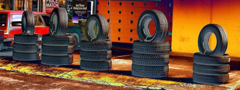 tires stacked outside shop