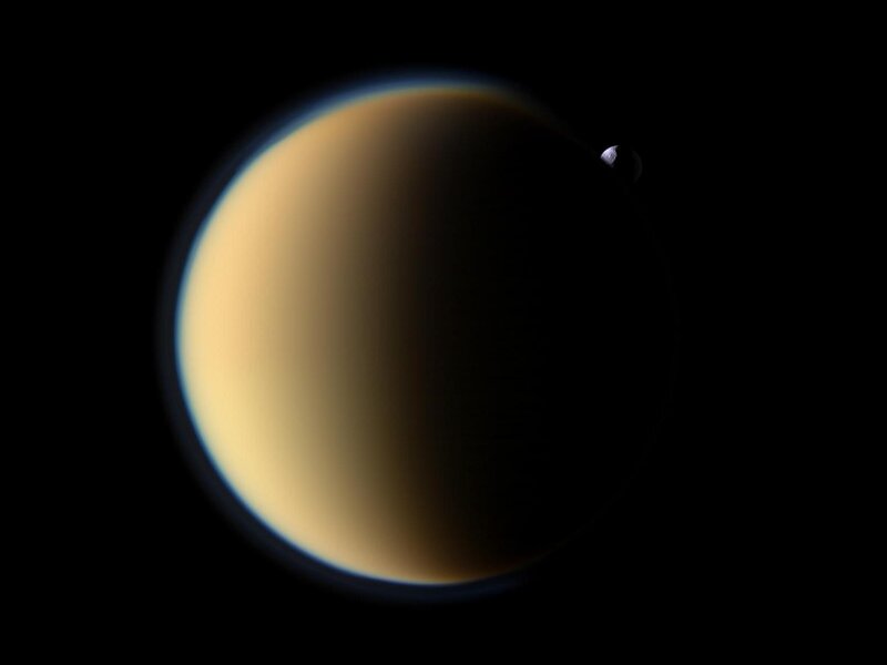 Titan and Enceladus in space