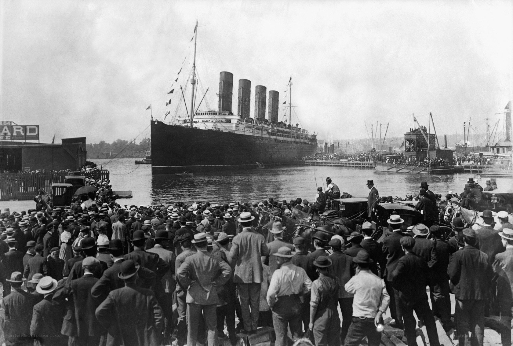 Titanic at dock with crowd