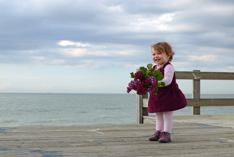 Toddler Holding Flowers
