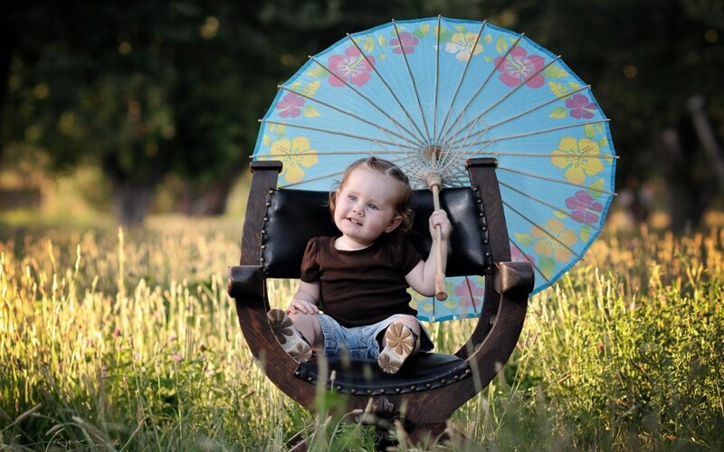 Toddler Holding Umbrella