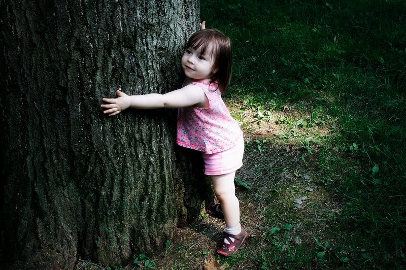 Toddler Hugging Tree