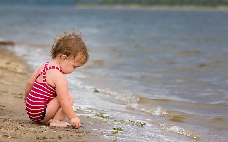 Toddler in Striped Swimsuit — Red