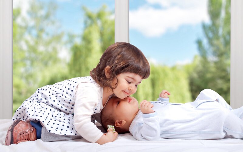 Toddler Kissing Baby — White