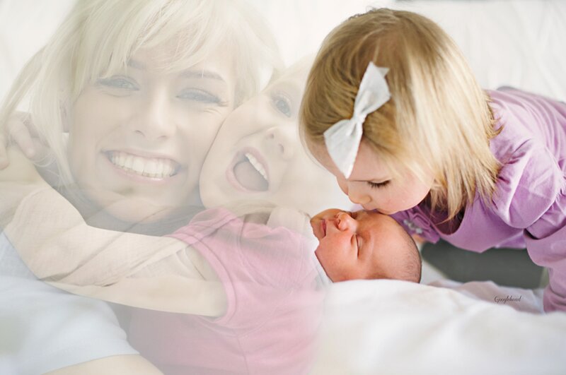 Toddler Kissing Newborn