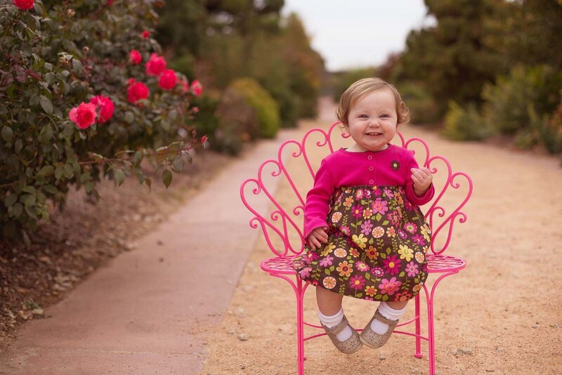 Toddler on Pink Chair