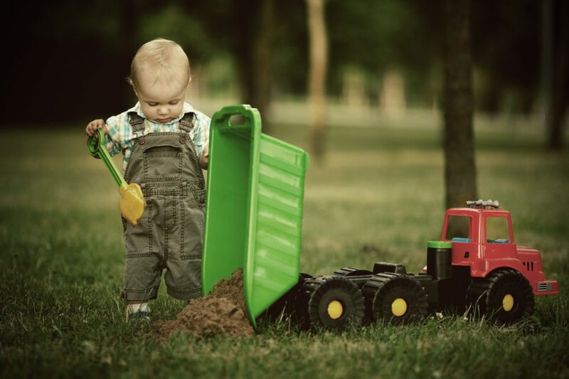 Toddler Playing with Toy Truck
