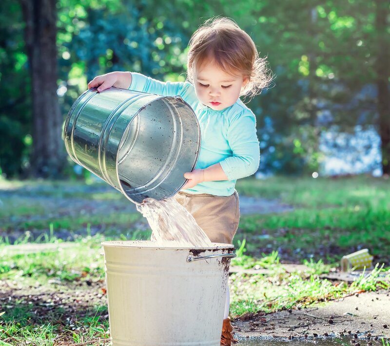 Toddler Pouring Water