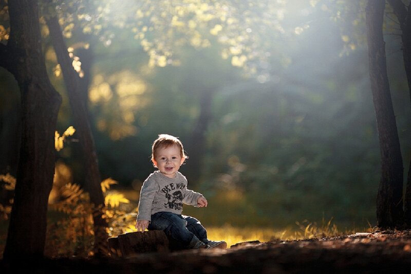 Toddler Sitting on Log