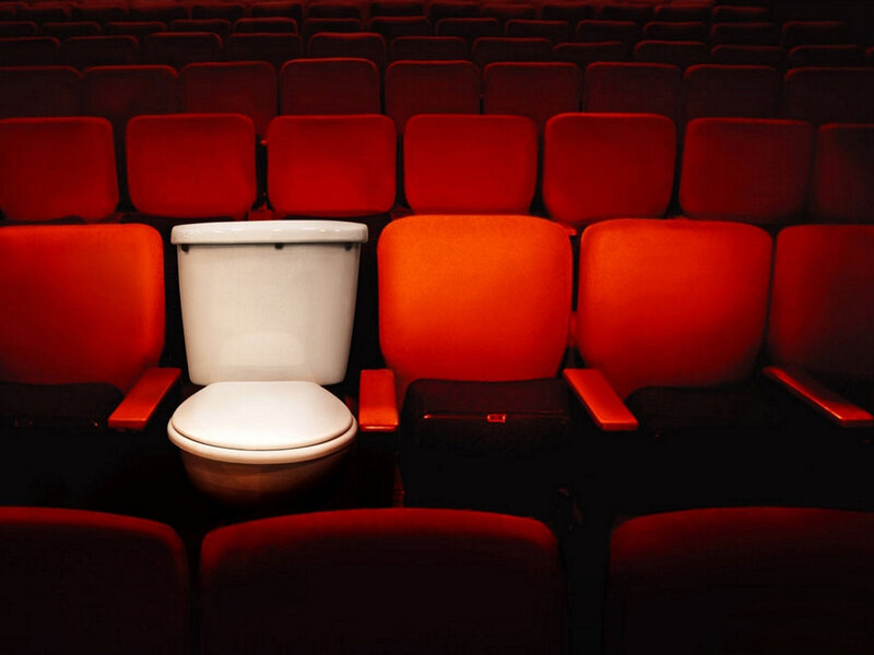 Toilet in theater seating