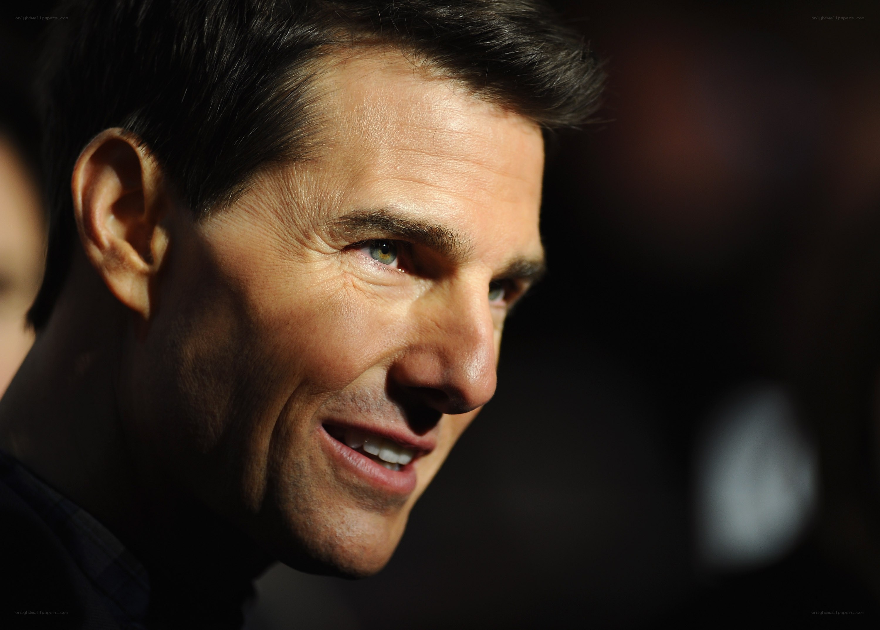 Tom Cruise smiling in profile