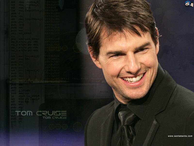 Tom Cruise smiling in suit