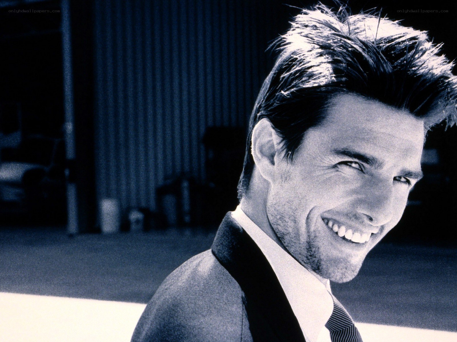 Tom Cruise smiling in suit
