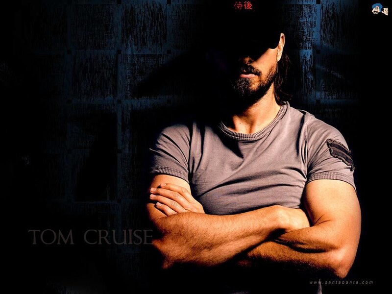 Tom Cruise with arms crossed