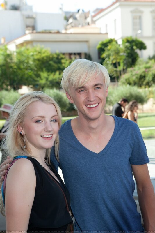 Tom Felton and a fan at an event