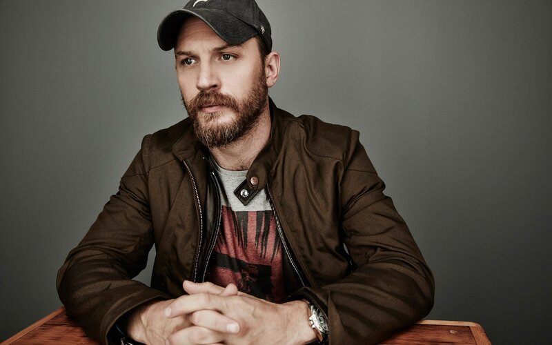 Tom Hardy in a cap and jacket