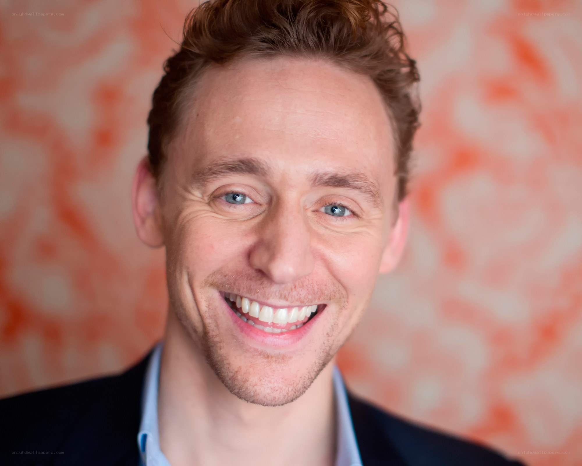 Tom Hiddleston smiling