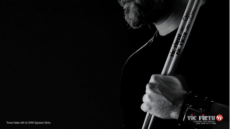 Tomas Haake with drumsticks