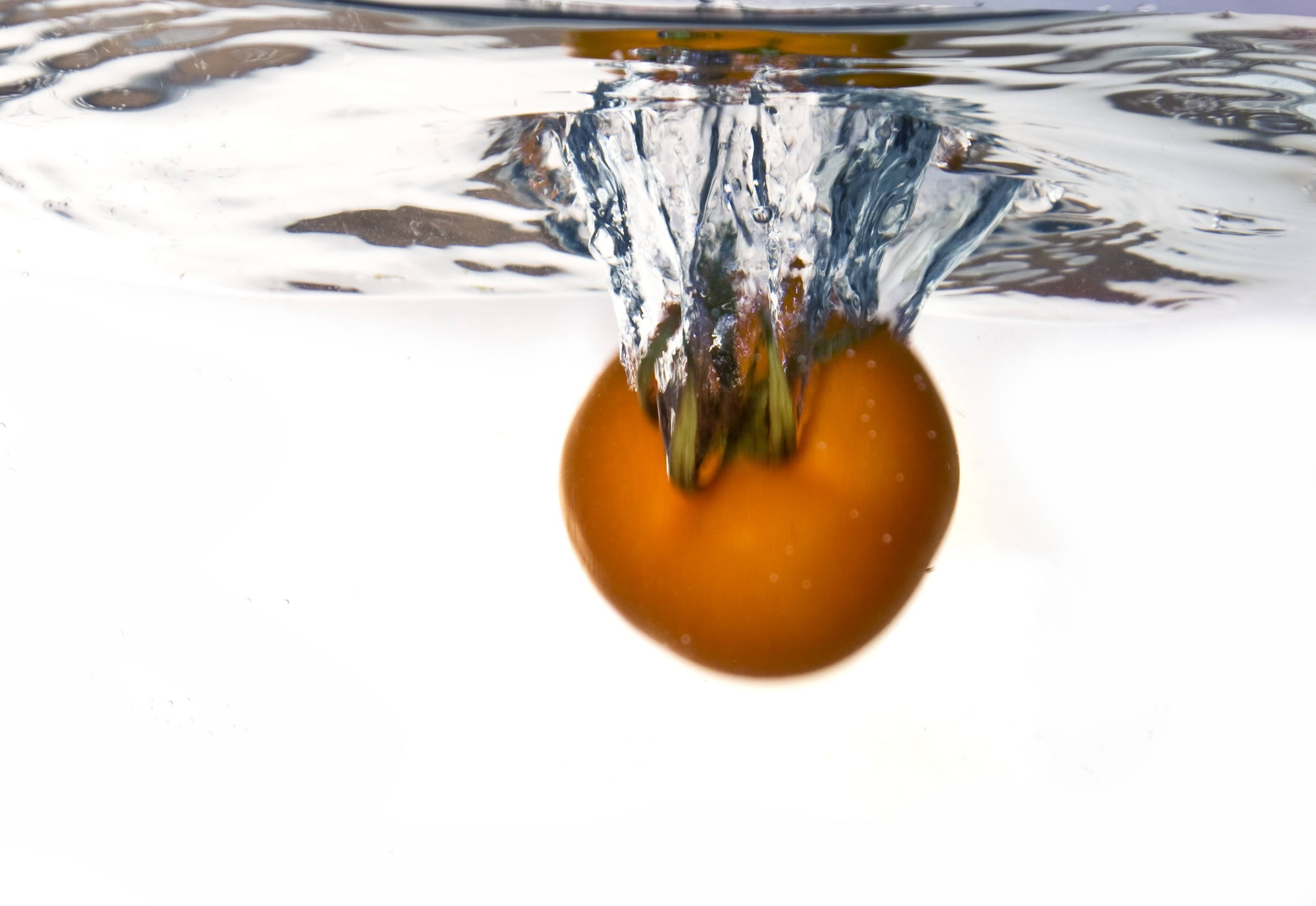 tomato falling into water