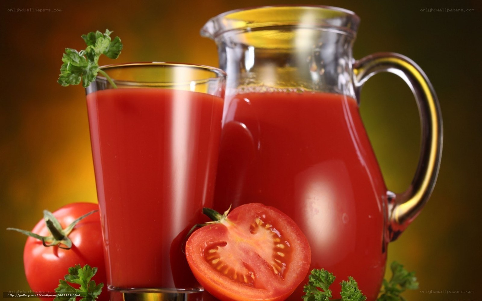 Tomato juice in glass and pitcher