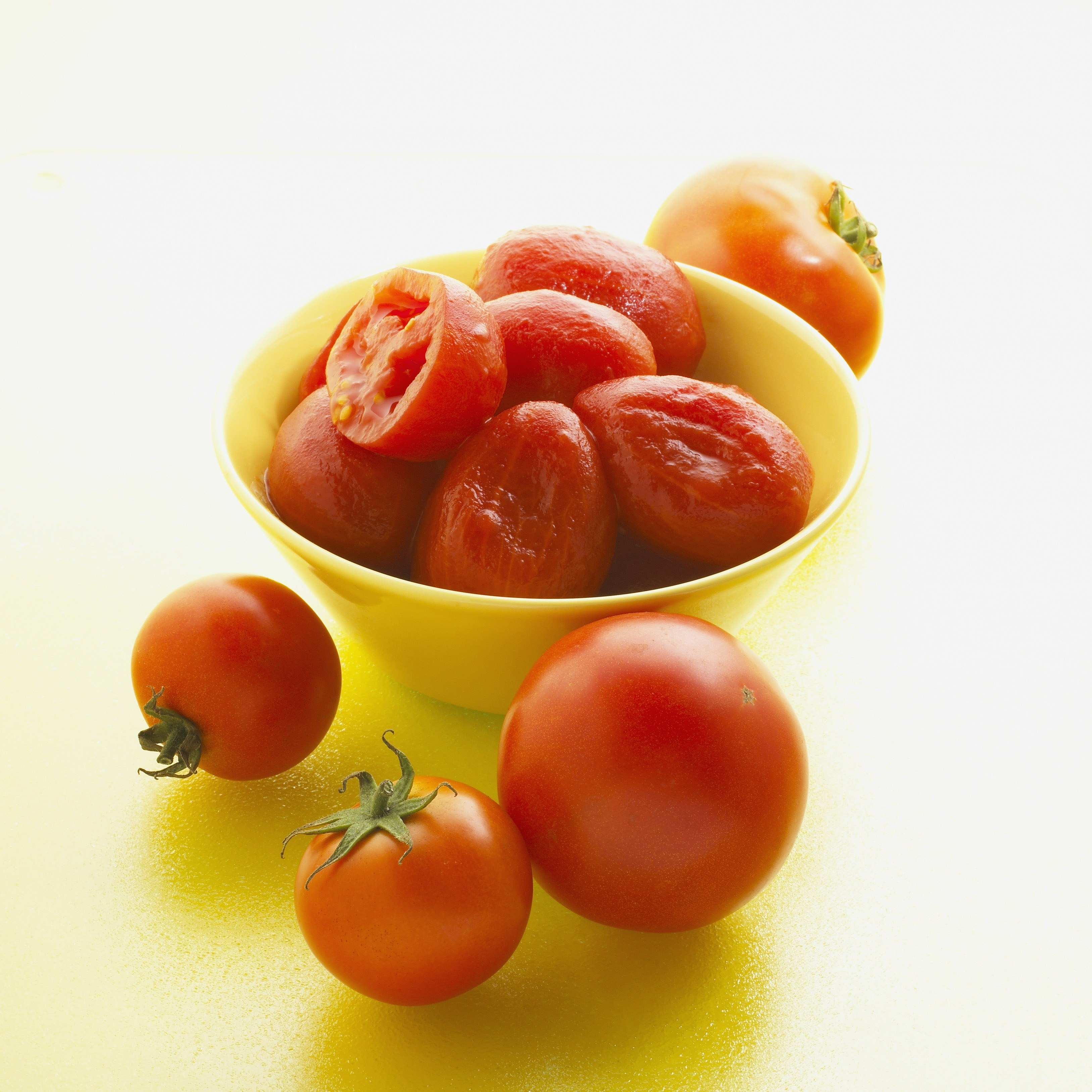 Tomatoes in a yellow bowl