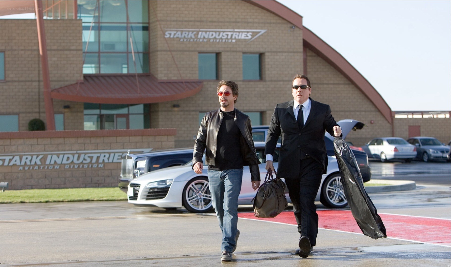 Tony Stark and security guard walking