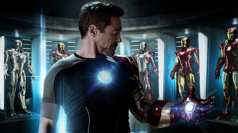 Tony Stark with Iron Man suits
