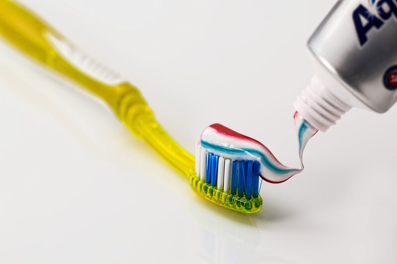 toothpaste on toothbrush