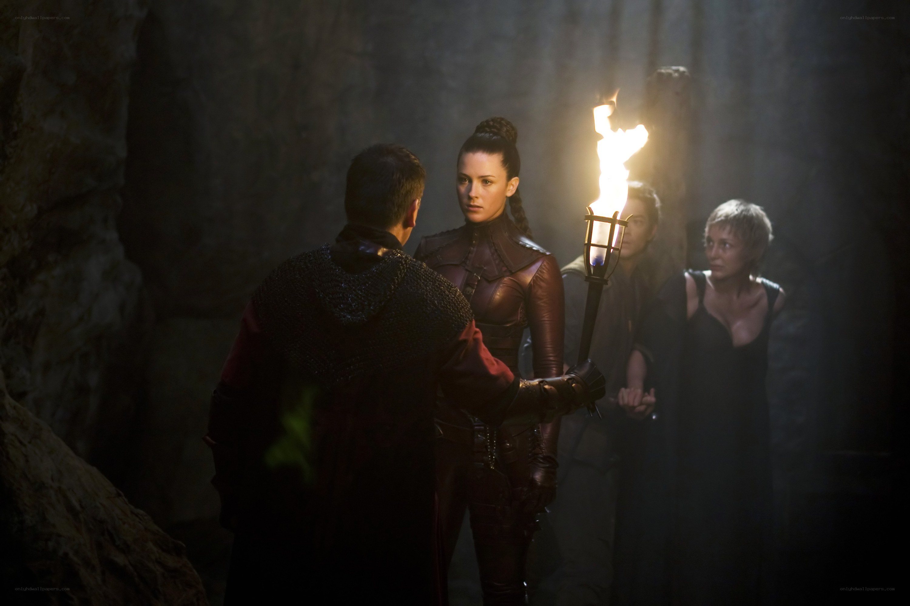 Torchlit cave confrontation