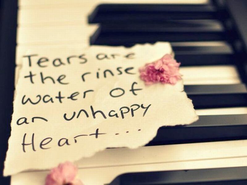 Torn Paper on Piano Keys