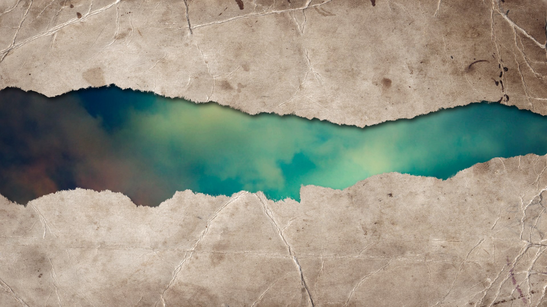 torn paper revealing water